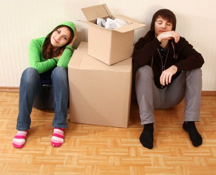 Packed boxes and furniture ready for domestic removals in a Clapham flat