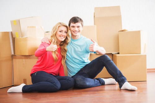 Professional movers navigating stairs and access challenges in Clapham