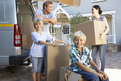 Man and van team carrying furniture with care in Clapham